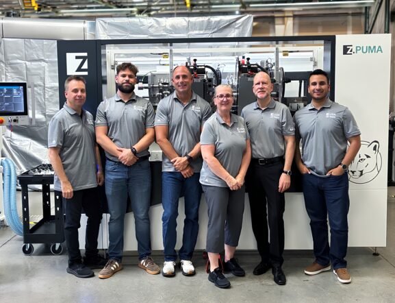ZAHORANSKY USA team during the company's 20th anniversary Open House in West Chicago with the Z.PUMA brush manufacturing machine.