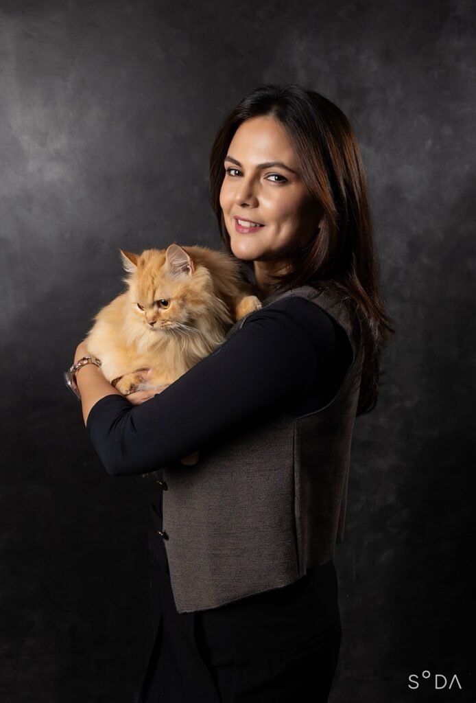 Andrea Cyrill Khurana holding a ginger cat